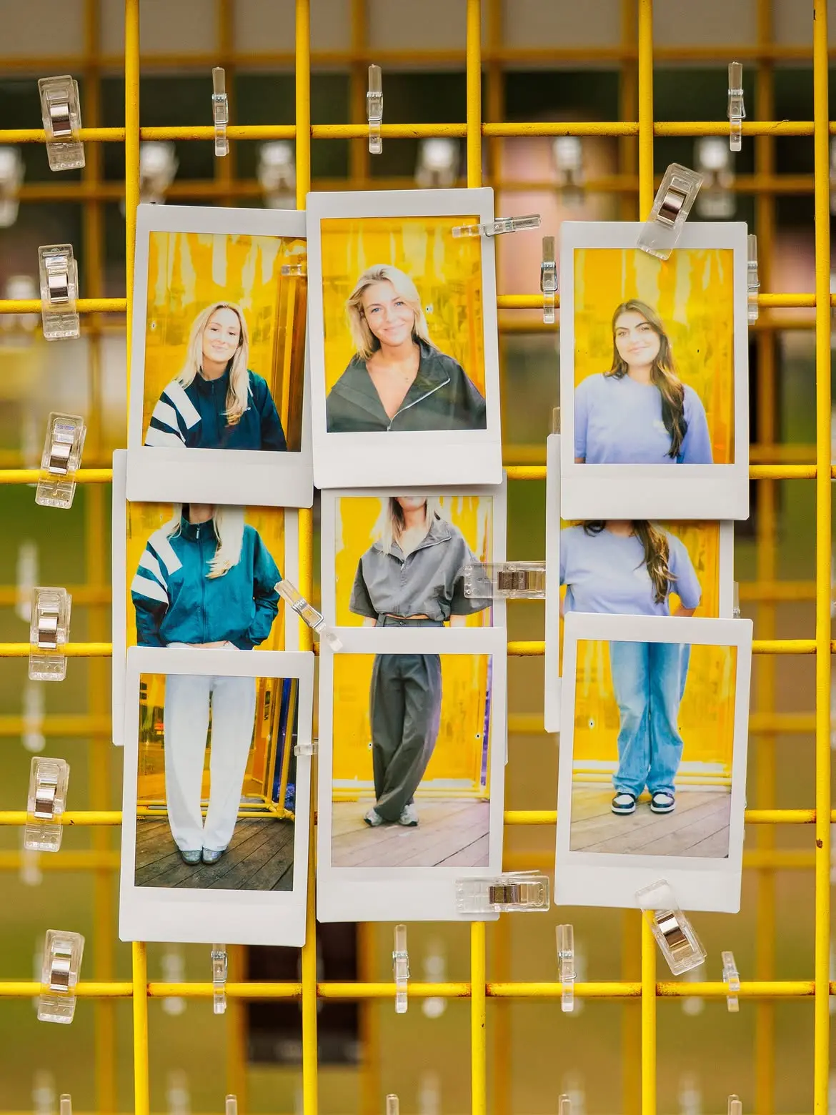Instax portraits of Bontgenoten festival visitors displayed on a yellow grid