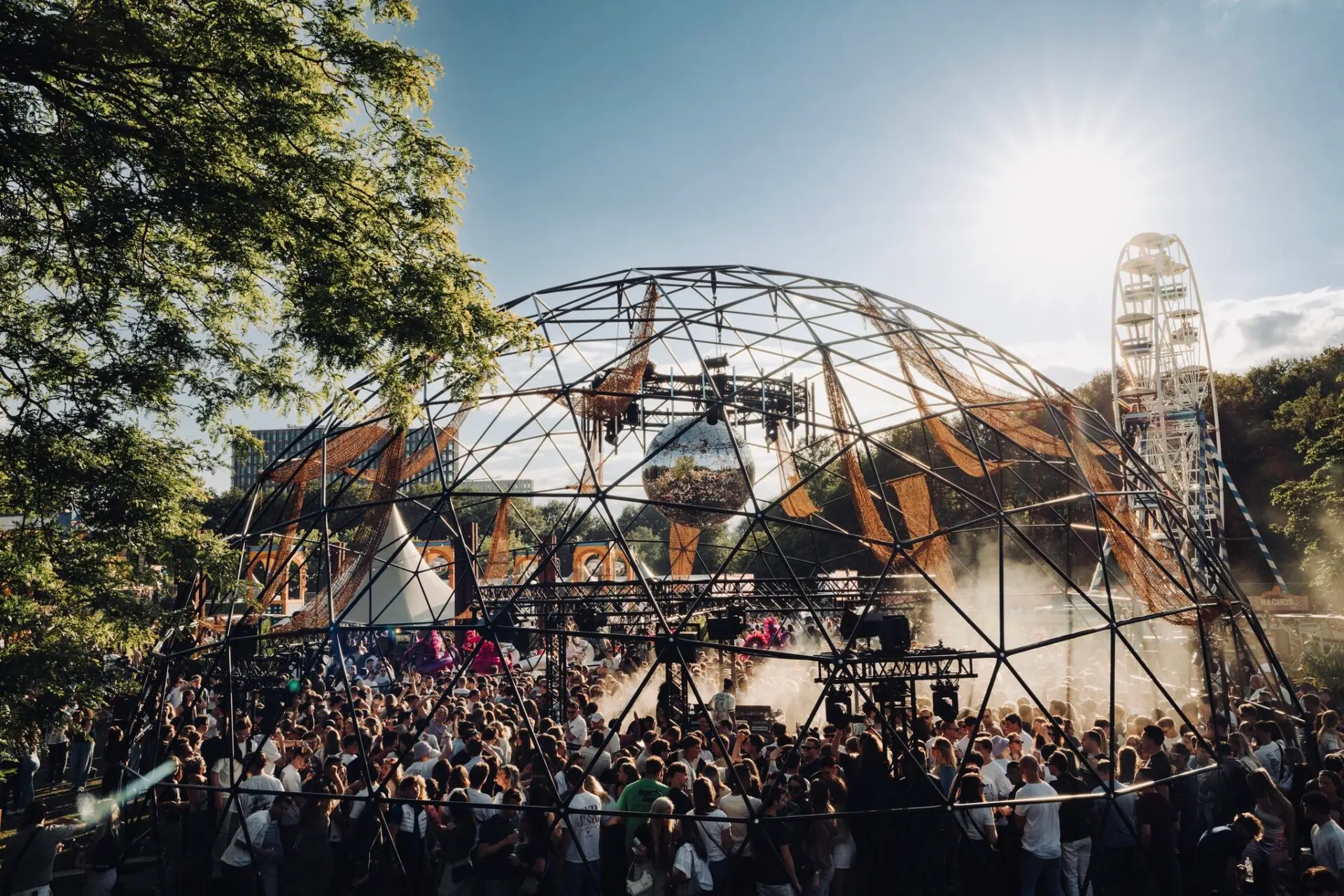 Fans dancing beneath the open-air dome at Bontgenoten Festival
